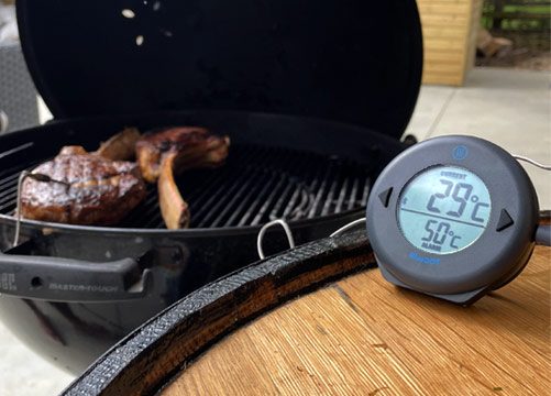 White DOT oven thermometer measuring the internal temperature of chicken with its heat proof probe