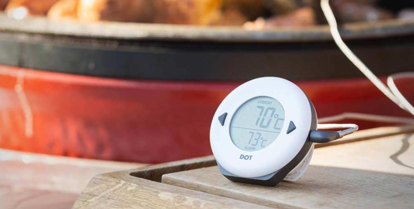 The DOT alarm thermometer placed next to the BBQ waiting for the alarm to sound at 73 degrees and the currect is 70 degrees